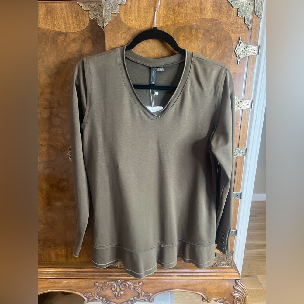 Women’s olive long sleeve top with ruffle bottom